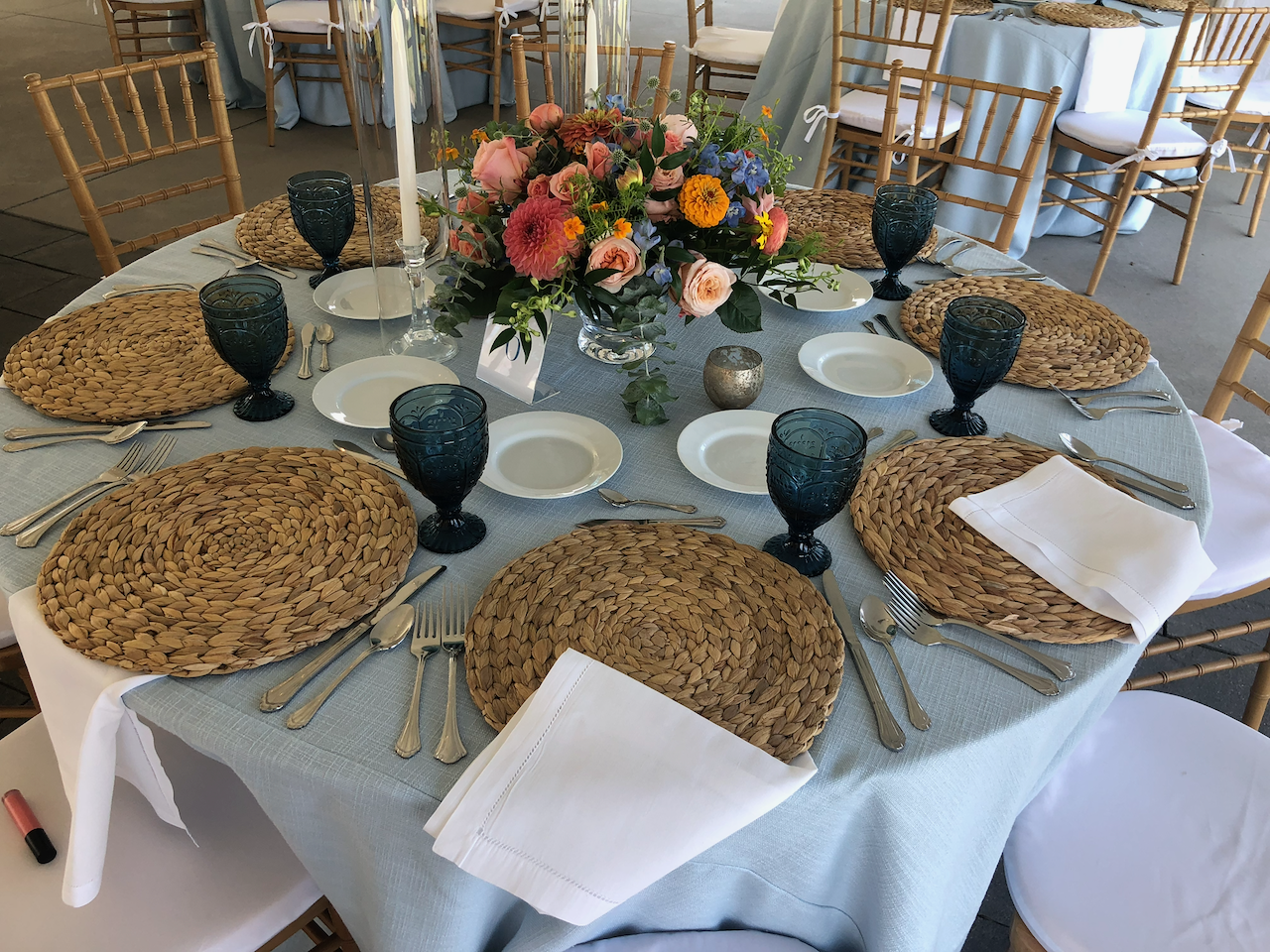 Verterra Winery table setup with floral centerpiece and fine dining ware.
